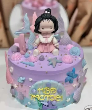 เมนูเค้กวันเกิดลายเจ้าหญิงน้อย พร้อมตกแต่งด้วยดอกไม้ทะเลและสัตว์ทะเลในโทนสีหวานพาสเทล เหมาะสำหรับชุดเค้กในโอกาสพิเศษสำหรับเด็กผู้หญิง.