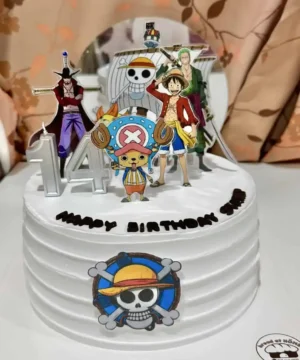 เค้กวันเกิดวันพีช พร้อมตัวละครจากอนิเมะ One Piece สำหรับฉลองวันเกิดในธีมการ์ตูนสุดน่ารักและสนุกสนาน.